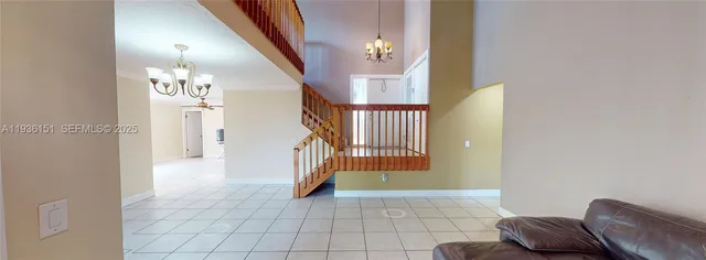 a view of entryway and hall with a rug