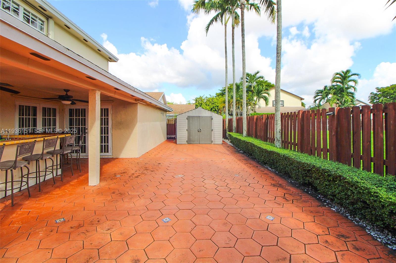4235 Southwest 148th Place Miami, FL 33185 - Photo 21 of 23 a front view of house with yard and trees