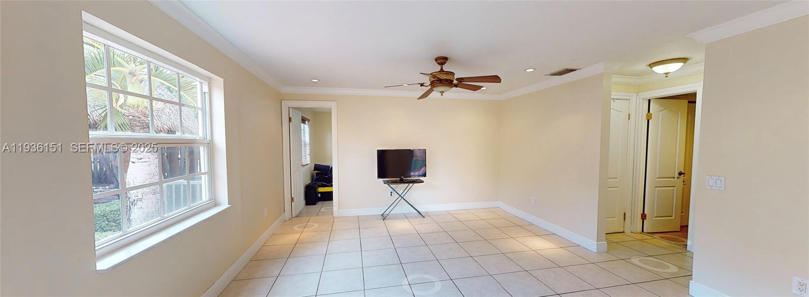 4235 Southwest 148th Place Miami, FL 33185 - Photo 4 of 23 a view of a hallway with windows and chandelier