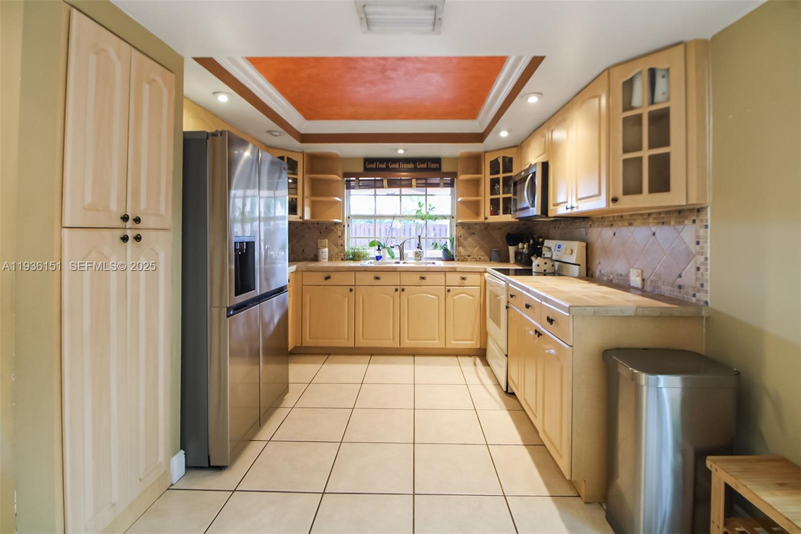 4235 Southwest 148th Place Miami, FL 33185 - Photo 5 of 23 a kitchen with stainless steel appliances granite countertop a refrigerator and a sink