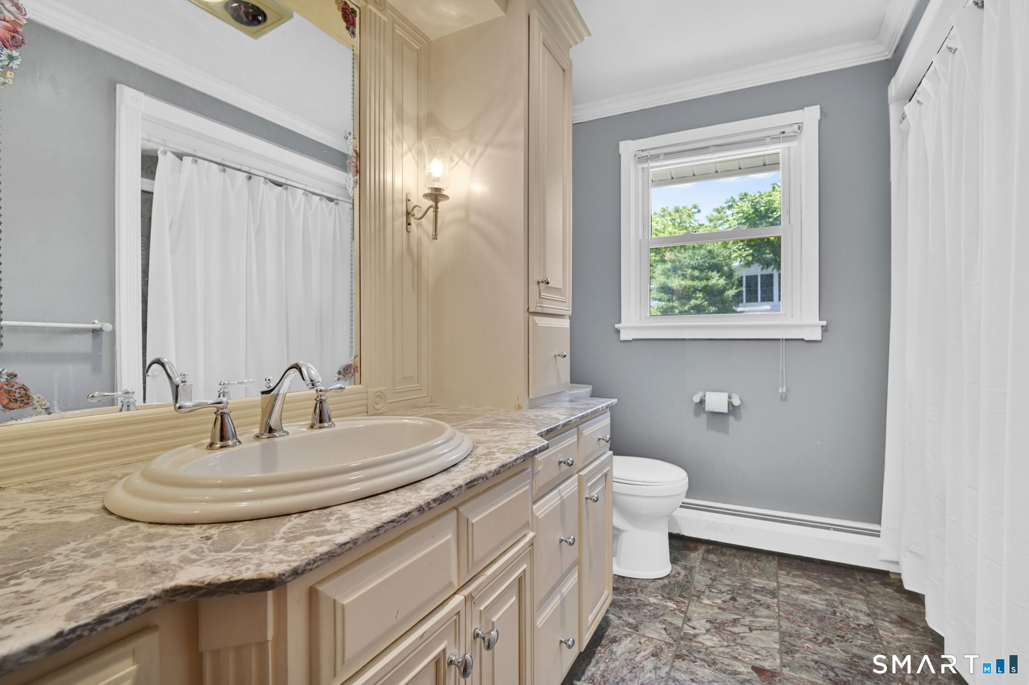 7 Rogers Drive Meriden, CT 06450 - Photo 18 of 40 a bathroom with a sink and a mirror