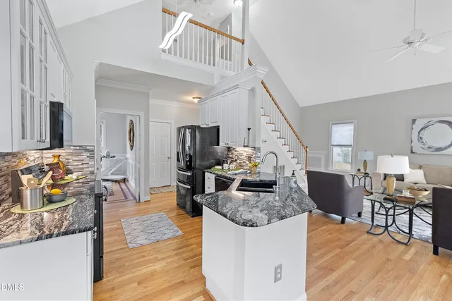 a kitchen with stainless steel appliances a stove sink microwave and cabinets