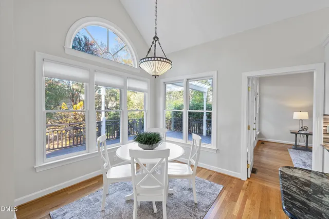 a living room with furniture fireplace and a view of kitchen