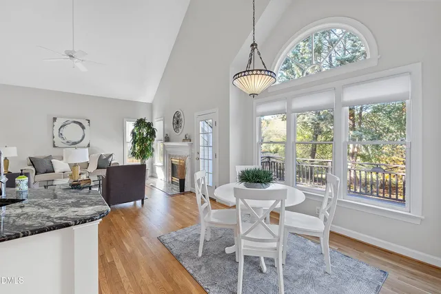a living room with furniture fireplace and window