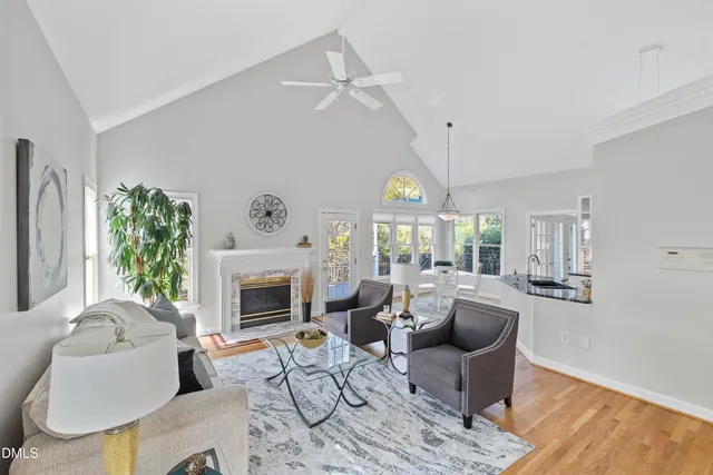 a living room with a bed furniture and a large window