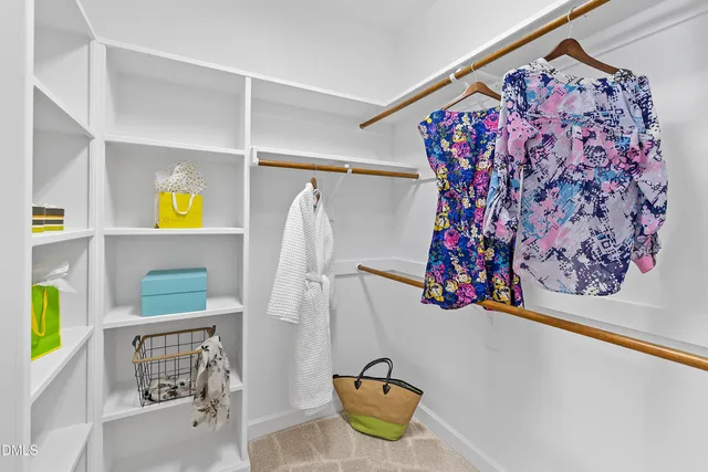 a bathroom with a granite countertop sink mirror vanity and toilet
