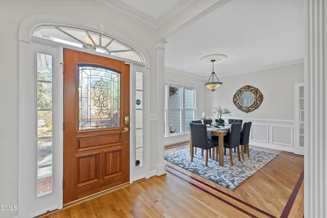 a living room with furniture rug and window