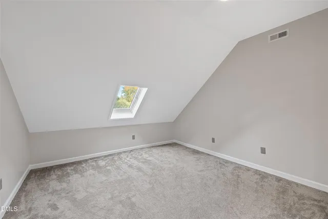 a view of a porch with wooden floor and fence