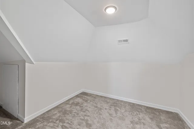 a view of a house with balcony and wooden floor