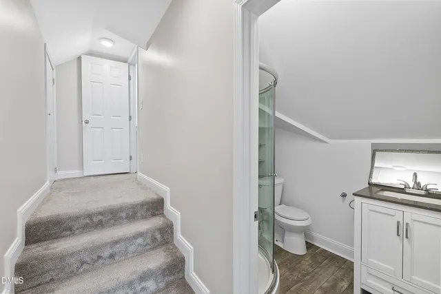 a view of a yard with snow on the road