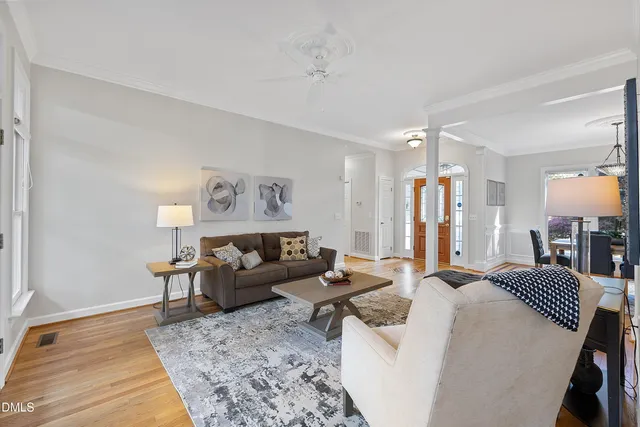 a kitchen with granite countertop a sink cabinets stainless steel appliances and a window