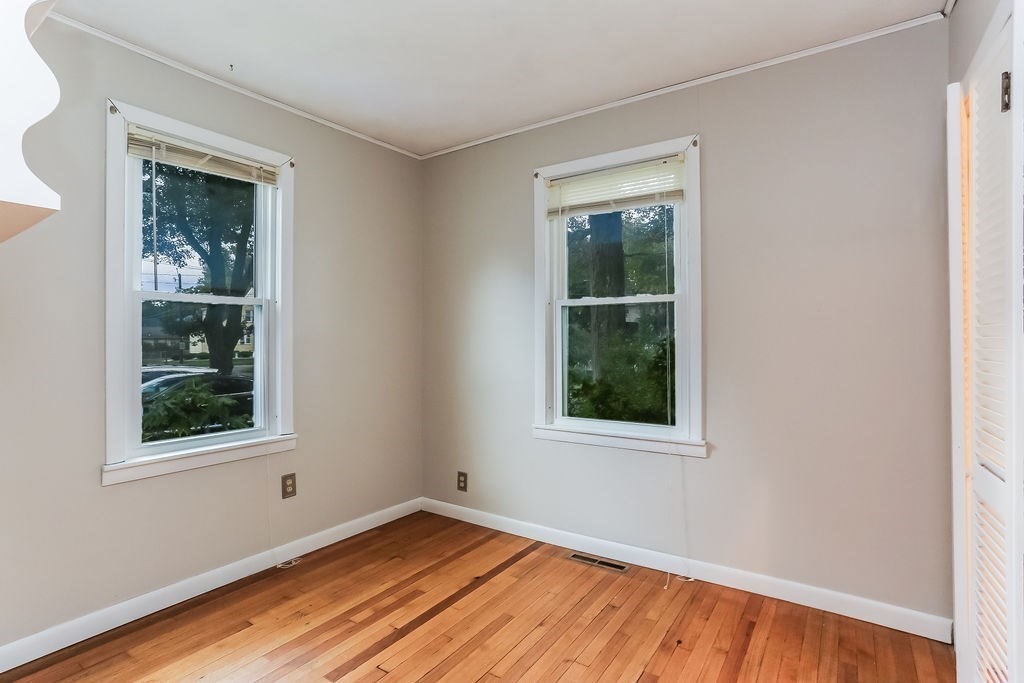 14 Bentley Street Springfield, MA 01108 - Photo 8 of 12 an empty room with a window