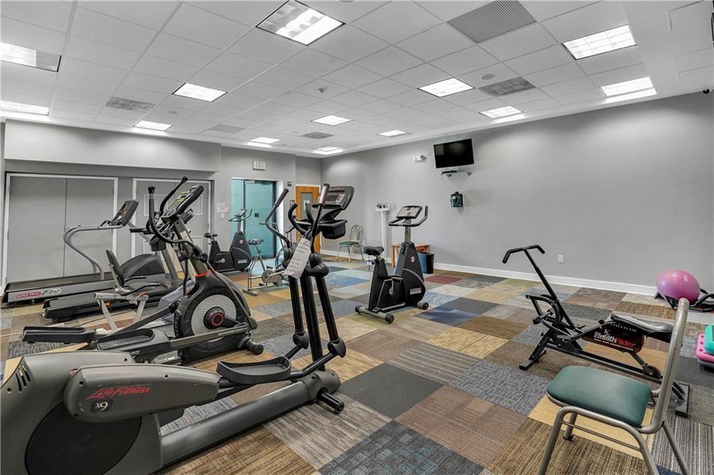 7300 Northwest 5th Court, Unit 101 Margate, FL 33063 - Photo 12 of 14 a view of a room with gym equipment