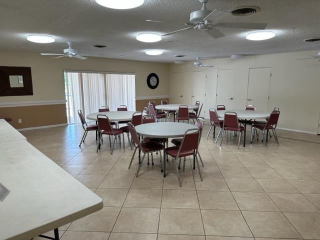 7300 Northwest 5th Court, Unit 101 Margate, FL 33063 - Photo 13 of 14 a view of a dining room with furniture