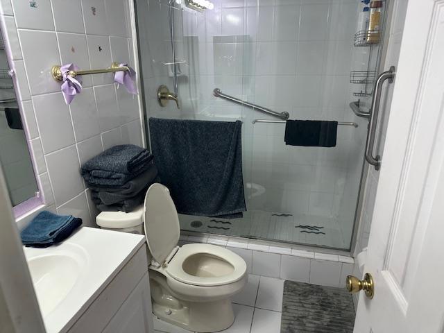 7300 Northwest 5th Court, Unit 101 Margate, FL 33063 - Photo 3 of 14 a bathroom with a sink toilet and shower