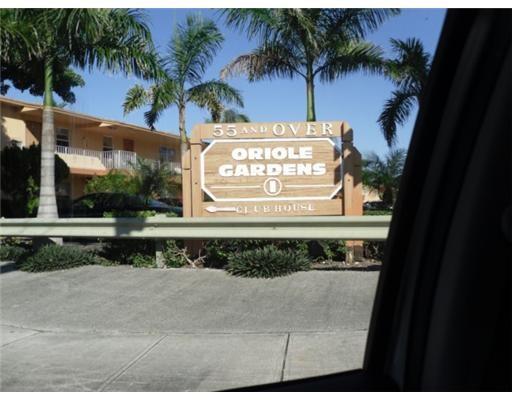 7300 Northwest 5th Court, Unit 101 Margate, FL 33063 - Photo 7 of 14 a sign that is on the side of a building