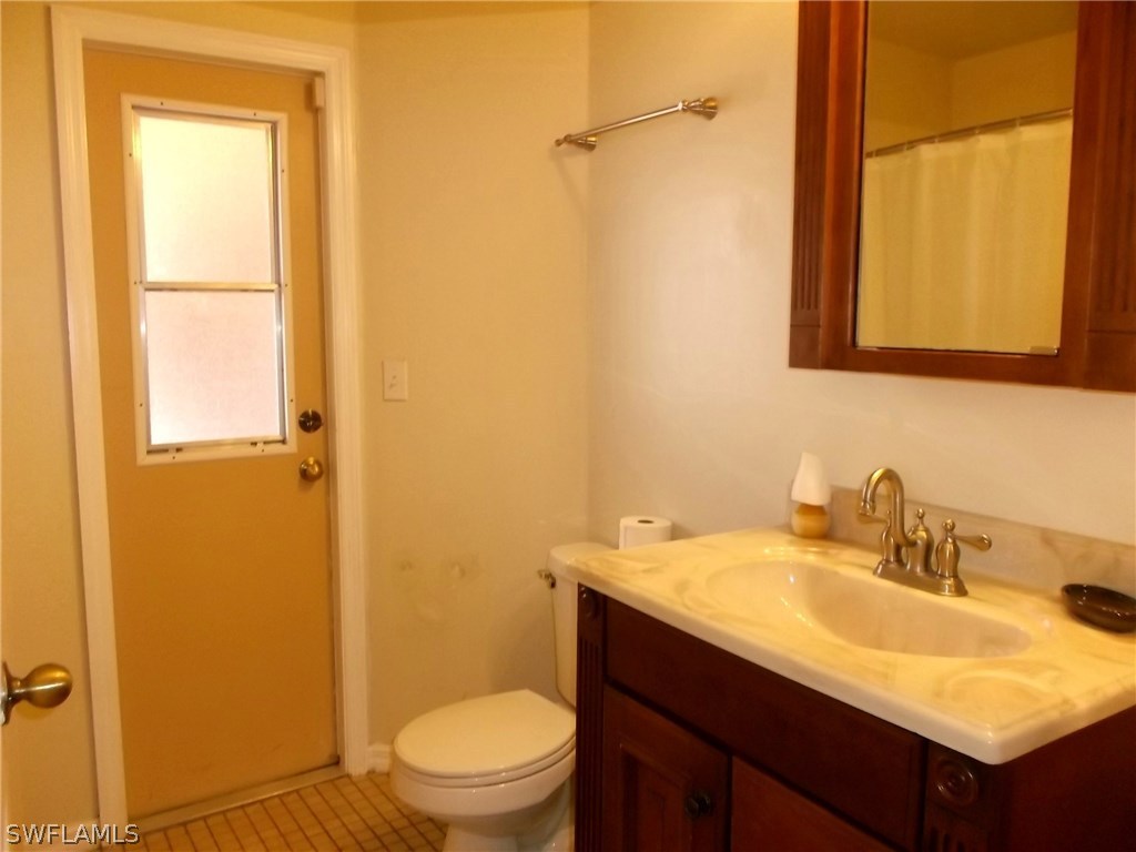 844 Rue Labeau Circle Fort Myers, FL 33913 - Photo 11 of 15 a bathroom with a sink a toilet and shower