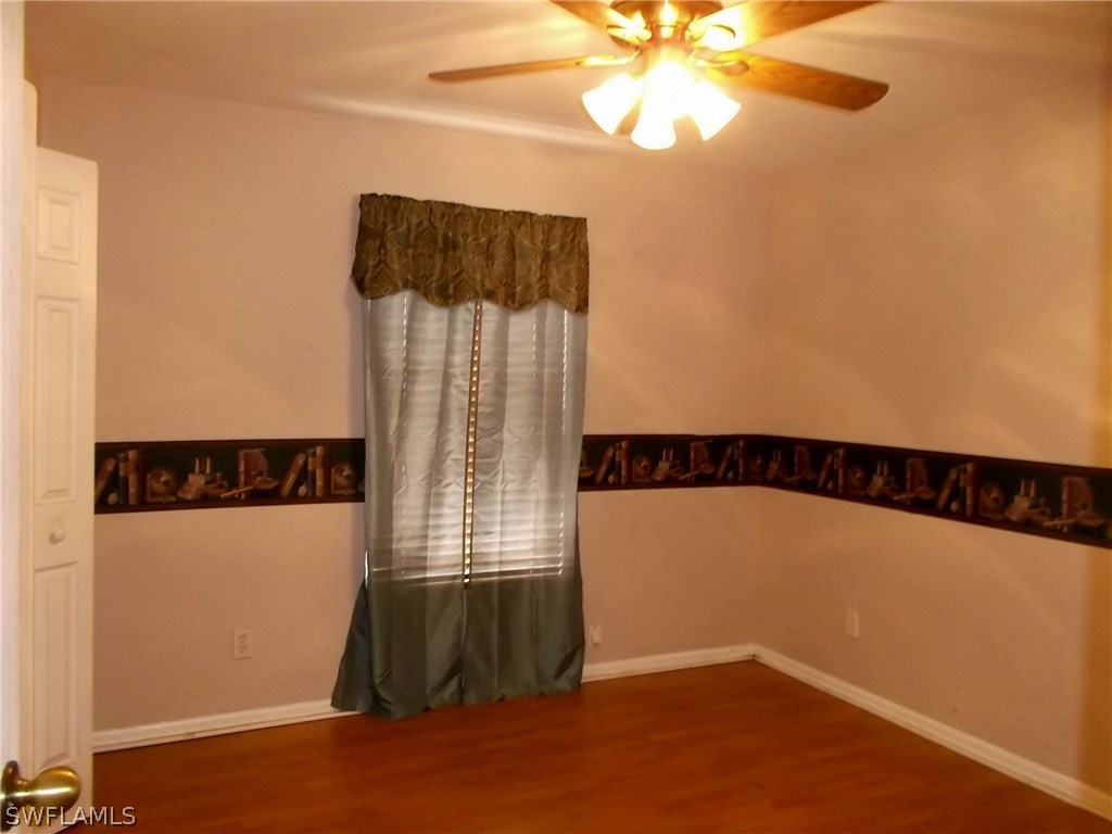 844 Rue Labeau Circle Fort Myers, FL 33913 - Photo 12 of 15 a view of an empty room with a window