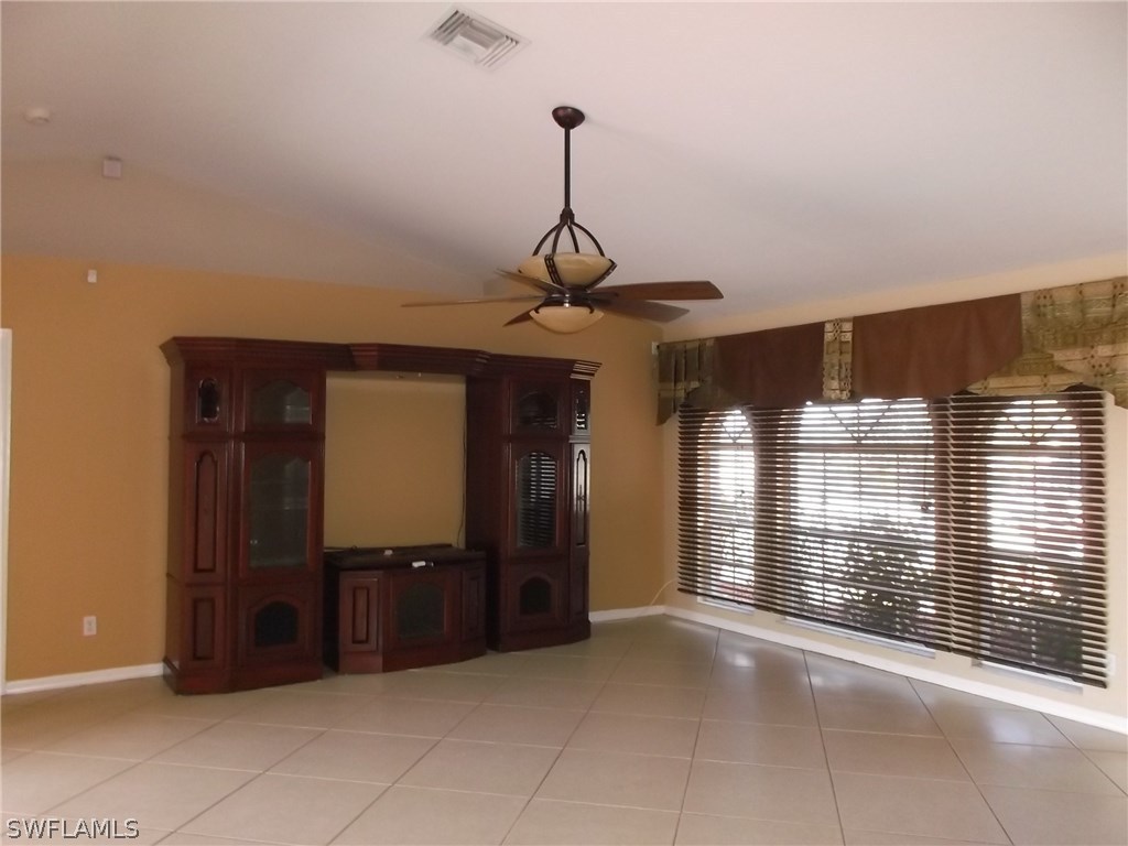 844 Rue Labeau Circle Fort Myers, FL 33913 - Photo 4 of 15 a view of a hallway with a chandelier