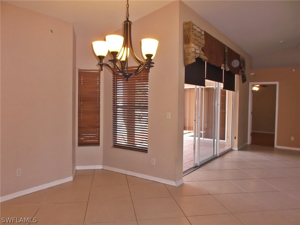 844 Rue Labeau Circle Fort Myers, FL 33913 - Photo 5 of 15 a view of a livingroom with chandelier closet and windows