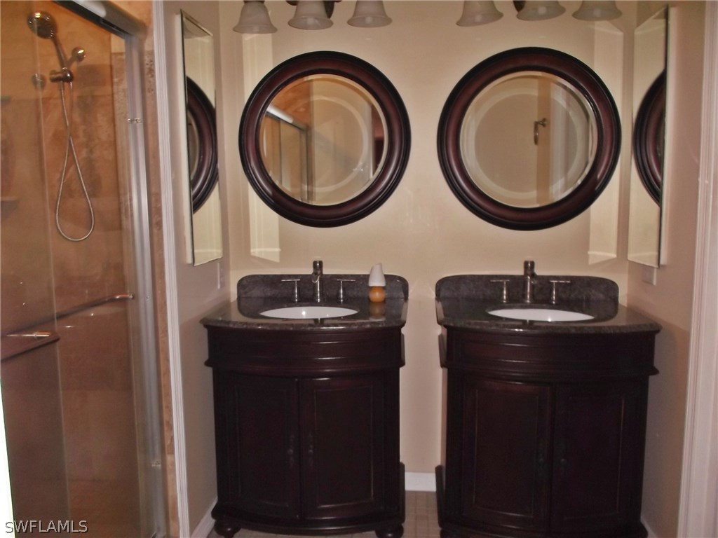 844 Rue Labeau Circle Fort Myers, FL 33913 - Photo 8 of 15 a bathroom with a sink and a mirror