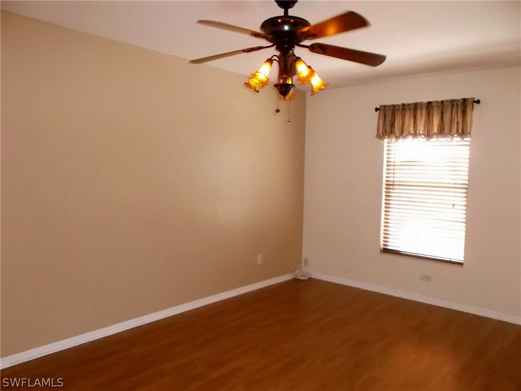 844 Rue Labeau Circle Fort Myers, FL 33913 - Photo 9 of 15 an empty room with a window and a fan