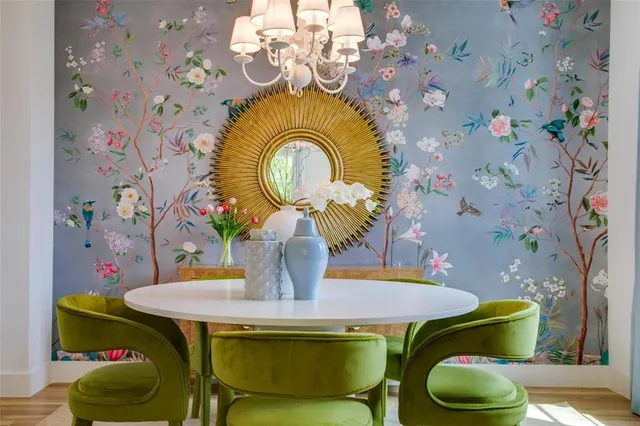 a view of a dining room with furniture and chandelier