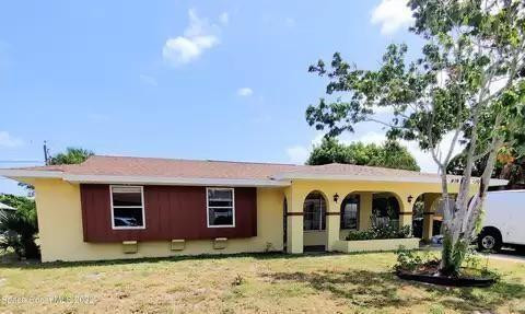 a view of a barn with yard