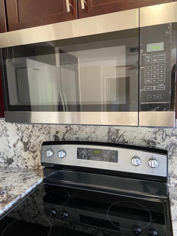 939 Burn Drive Northeast Palm Bay, FL 32905 - Photo 5 of 15 a close view of stove top oven