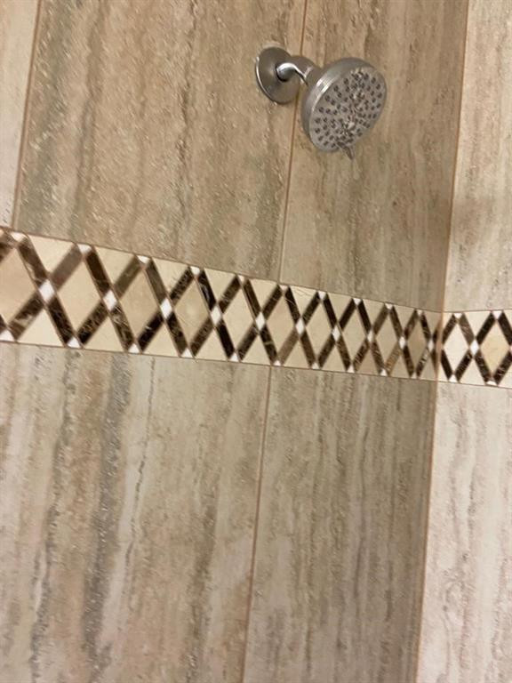 939 Burn Drive Northeast Palm Bay, FL 32905 - Photo 8 of 15 a bathroom with a shower