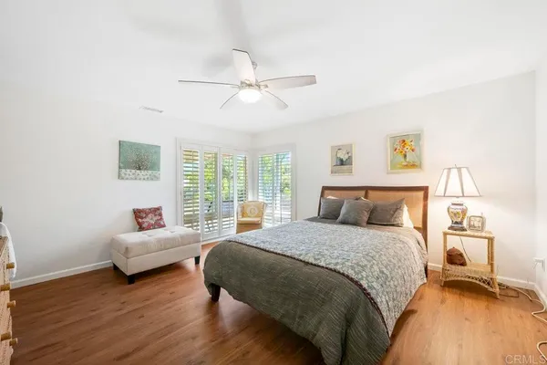 a bedroom with a bed and a couch