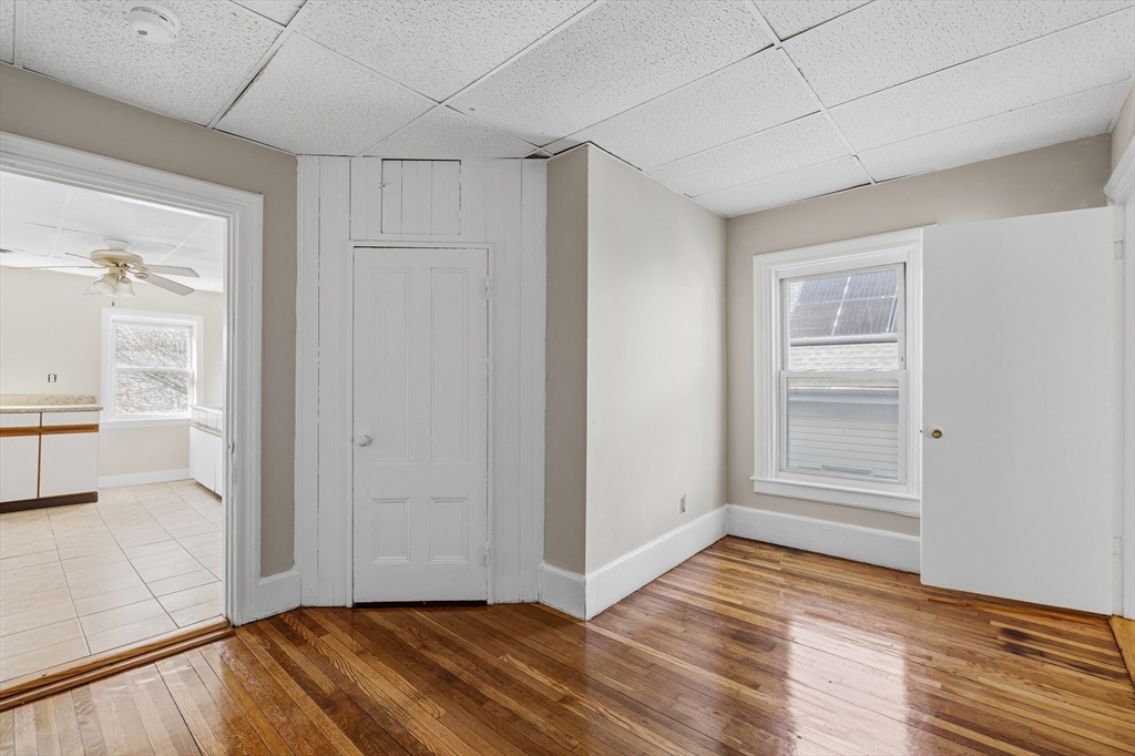 28 Prospect Street Brockton, MA 02301 - Photo 16 of 22 a view of hallway with wooden floor