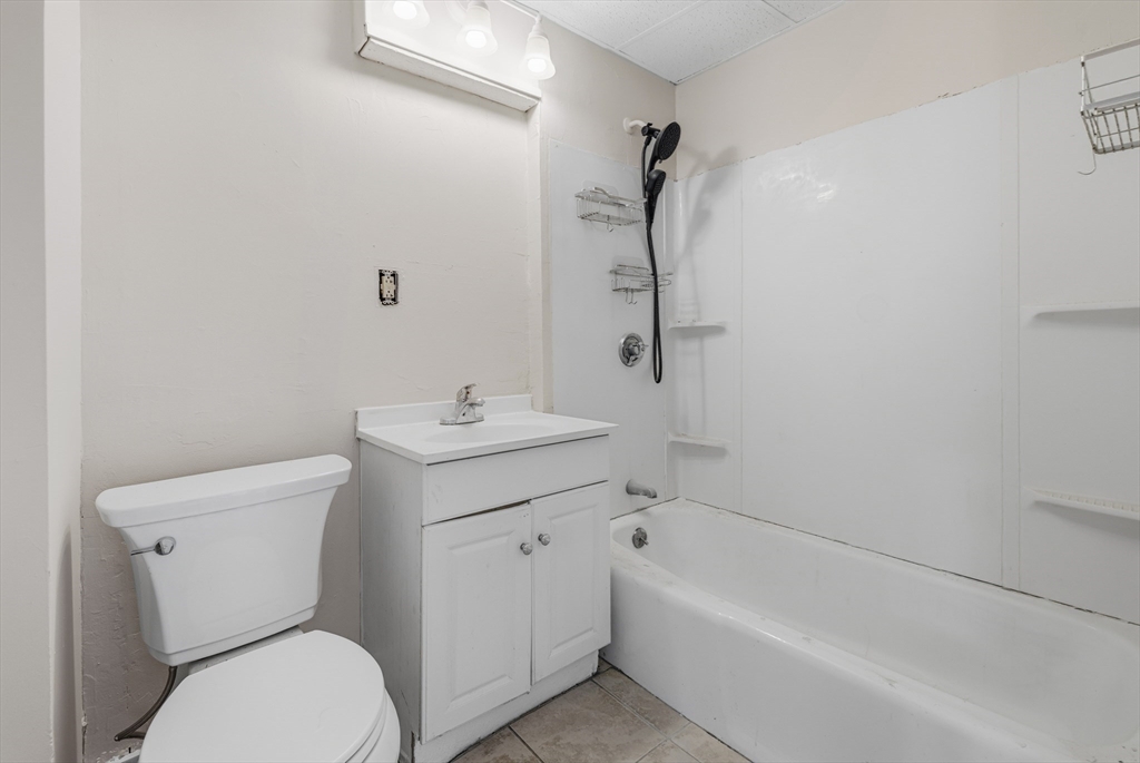 28 Prospect Street Brockton, MA 02301 - Photo 19 of 22 a bathroom with a sink toilet and bathtub