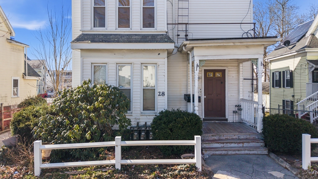 28 Prospect Street Brockton, MA 02301 - Photo 4 of 22 a front view of a house with a garden