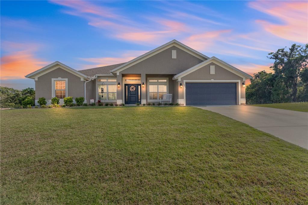 25 Northwest 45th Loop Ocala, FL 34475 - Photo 1 of 1 a front view of a house with a yard
