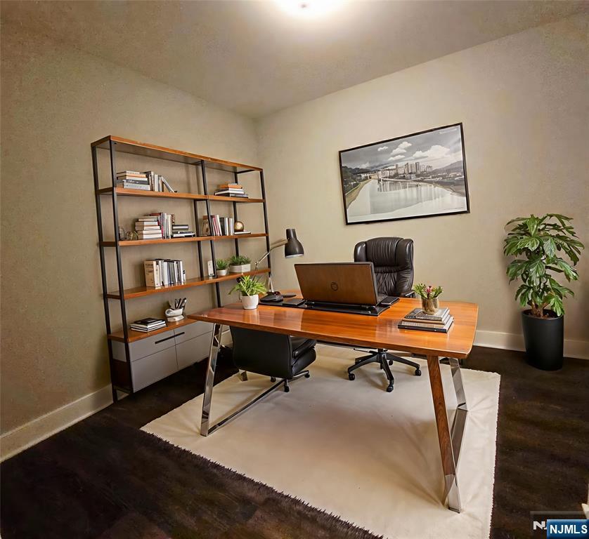 235 Ridge Road North Arlington, NJ 07031 - Photo 8 of 13 a view of a workspace with a bookshelf