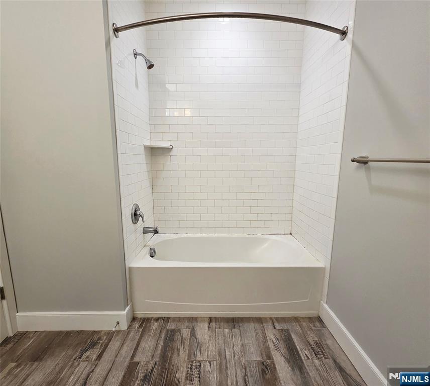 235 Ridge Road North Arlington, NJ 07031 - Photo 10 of 13 a bathroom with a bathtub and a shower