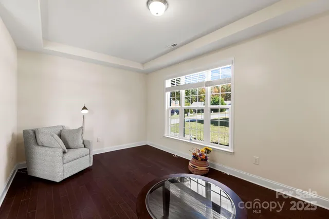 a bedroom with furniture and a window