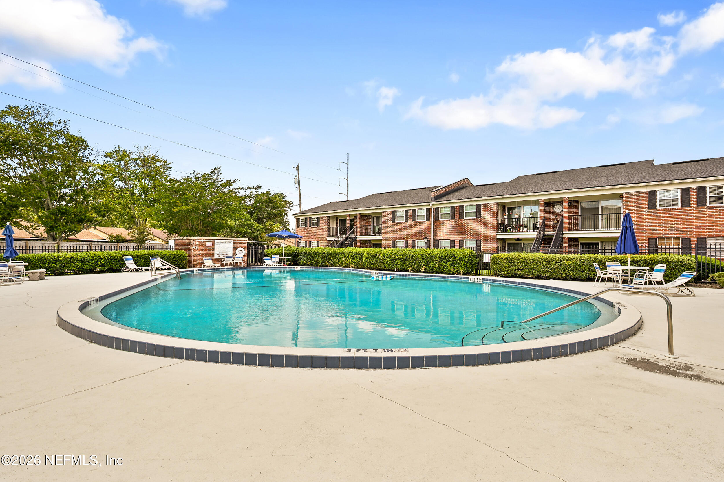 4915 Baymeadows Road, Unit 6G Jacksonville, FL 32217 - Photo 40 of 44 a view of a swimming pool and a buildings