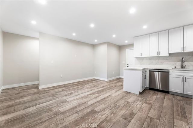 a view of kitchen with wooden floor