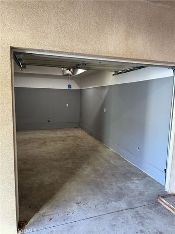 a view of outdoor sitting area with chairs and table
