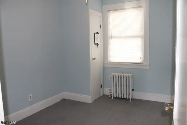 a kitchen with a refrigerator and a stove