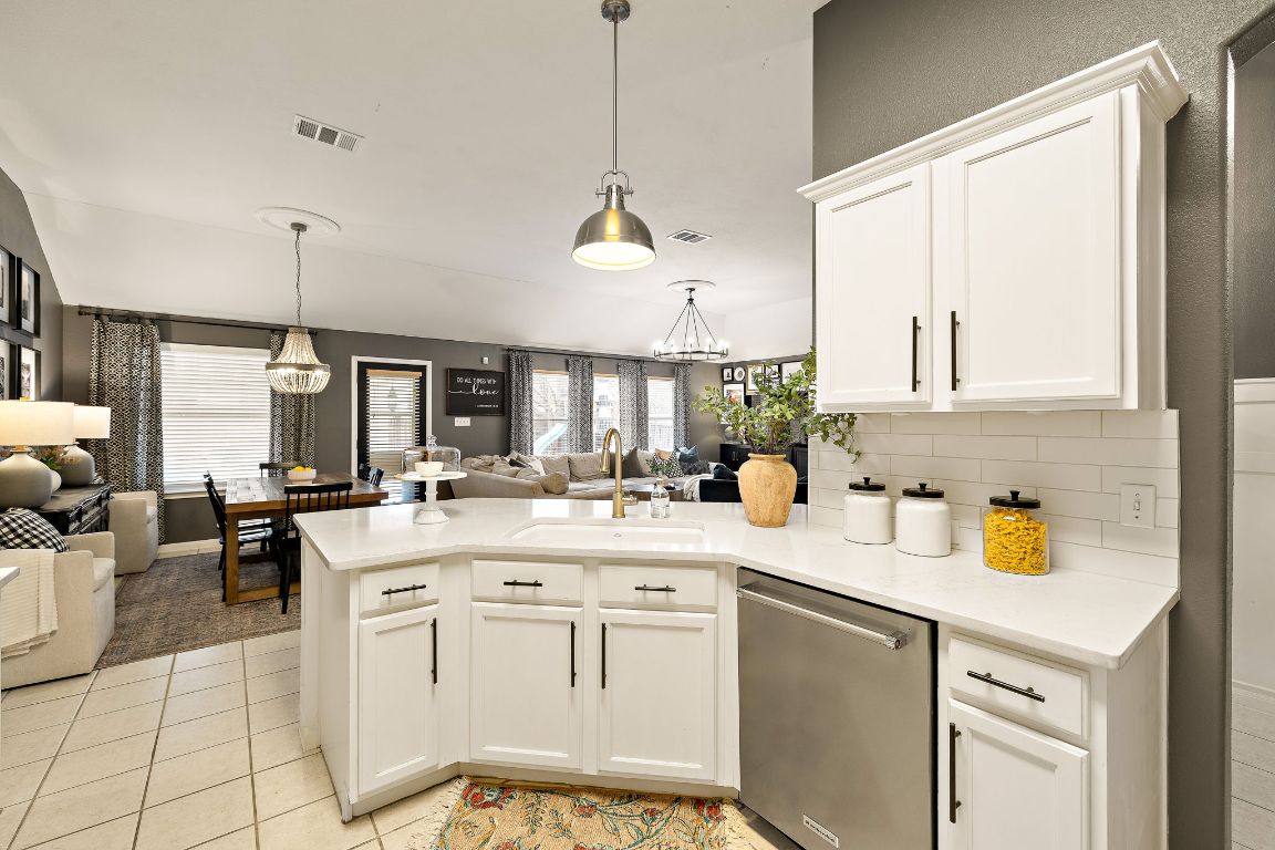 131 Chandler Pointe Loop Round Rock, TX 78665 - Photo 15 of 31 a kitchen with a sink stove and cabinets