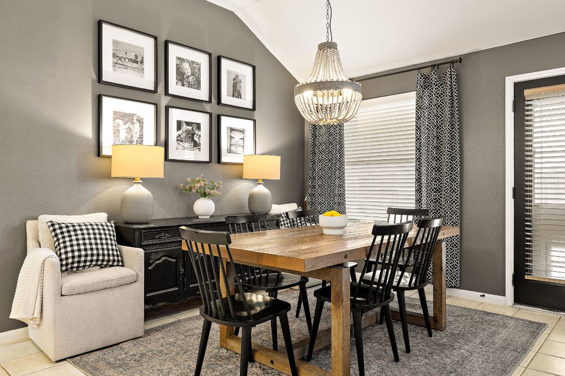 131 Chandler Pointe Loop Round Rock, TX 78665 - Photo 16 of 31 a view of a dining room with furniture wooden floor and chandelier