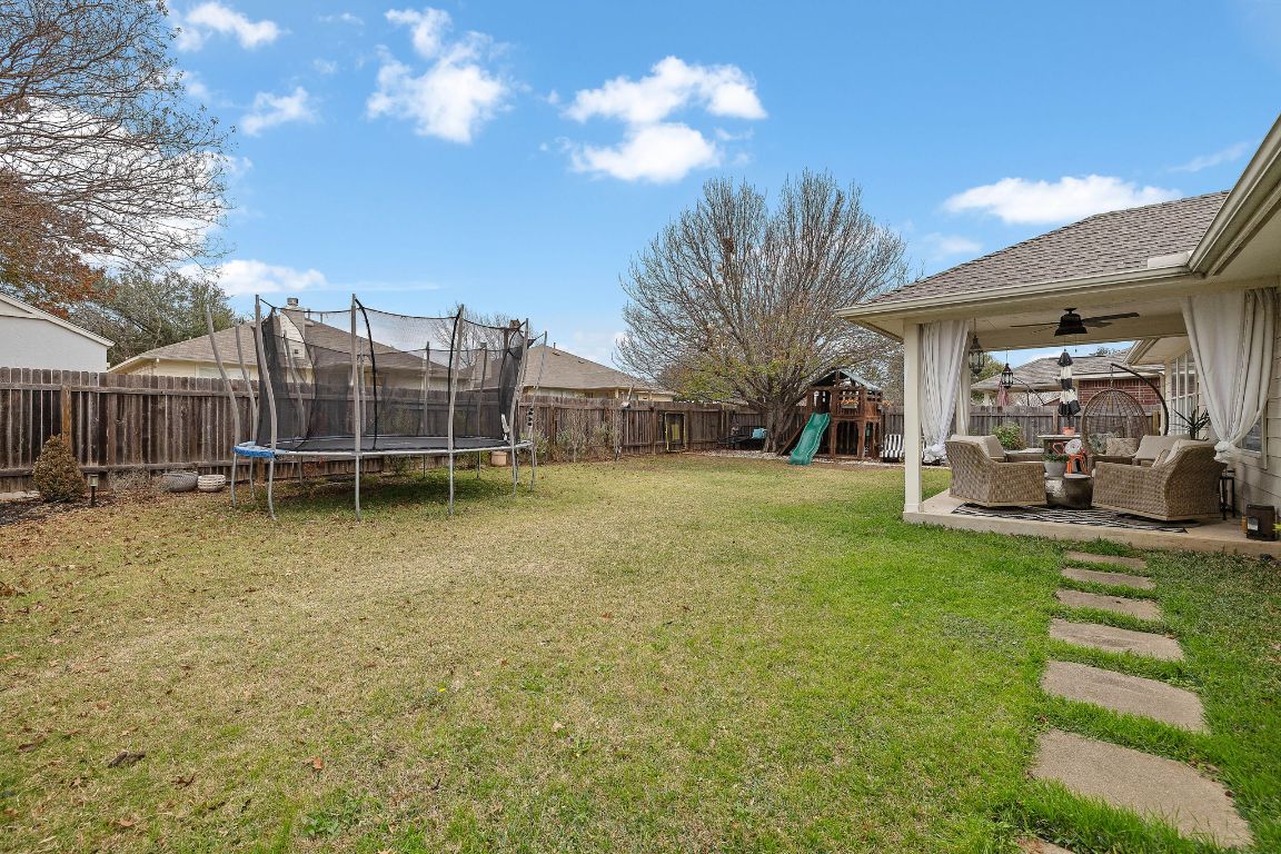 131 Chandler Pointe Loop Round Rock, TX 78665 - Photo 26 of 31 a view of a house with backyard and sitting area
