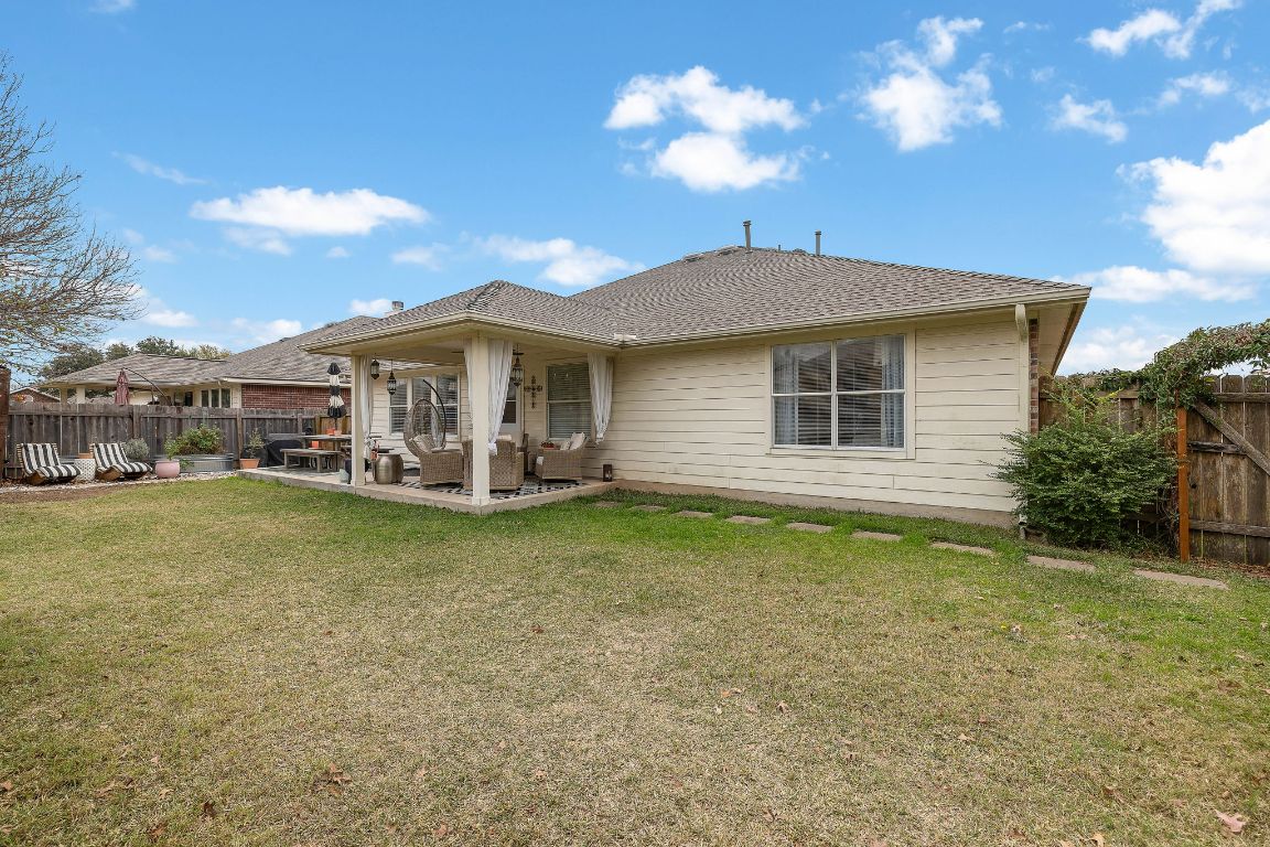 131 Chandler Pointe Loop Round Rock, TX 78665 - Photo 27 of 31 a view of a house with a patio