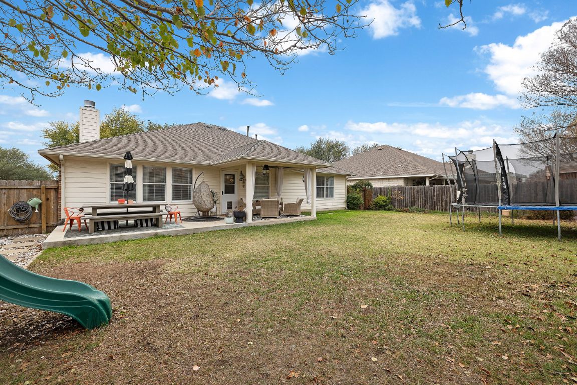 131 Chandler Pointe Loop Round Rock, TX 78665 - Photo 28 of 31 a front view of a house with swimming pool having outdoor seating