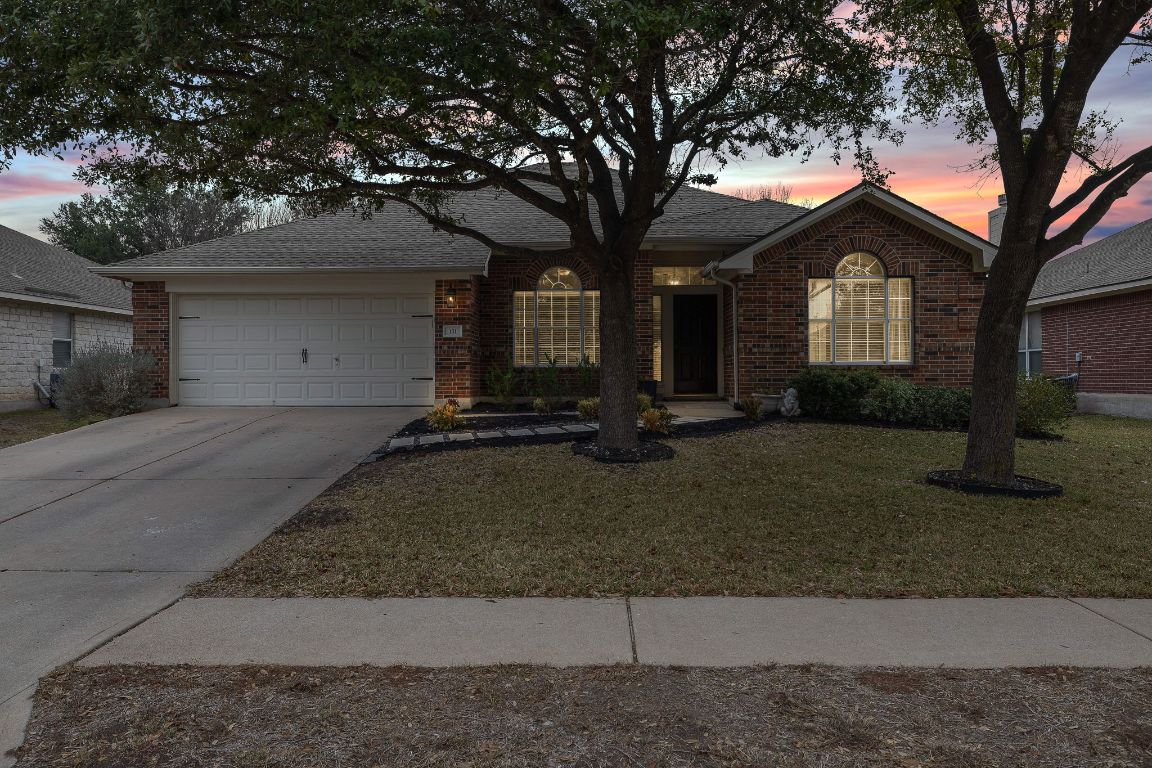 131 Chandler Pointe Loop Round Rock, TX 78665 - Photo 31 of 31 a front view of a house with a yard and tree