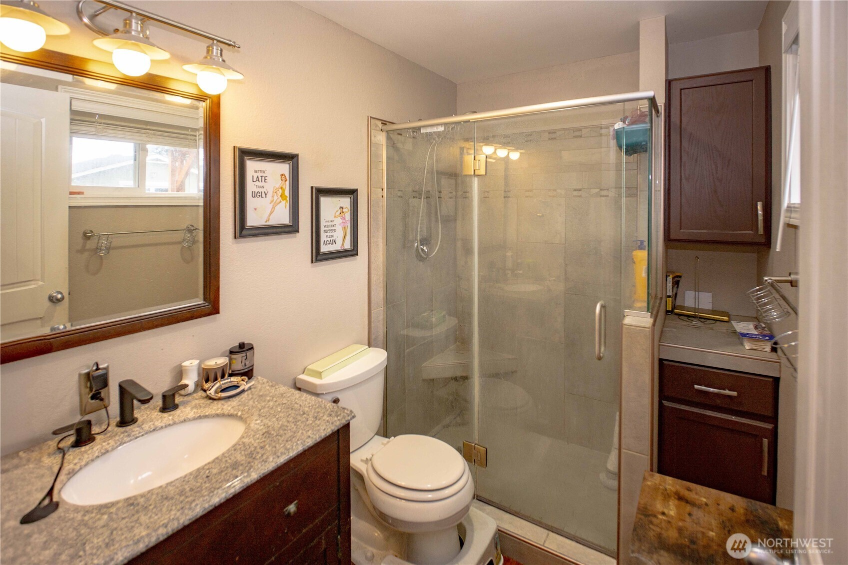 151 Valley View Drive Sequim, WA 98382 - Photo 25 of 40 a bathroom with a granite countertop sink toilet and shower