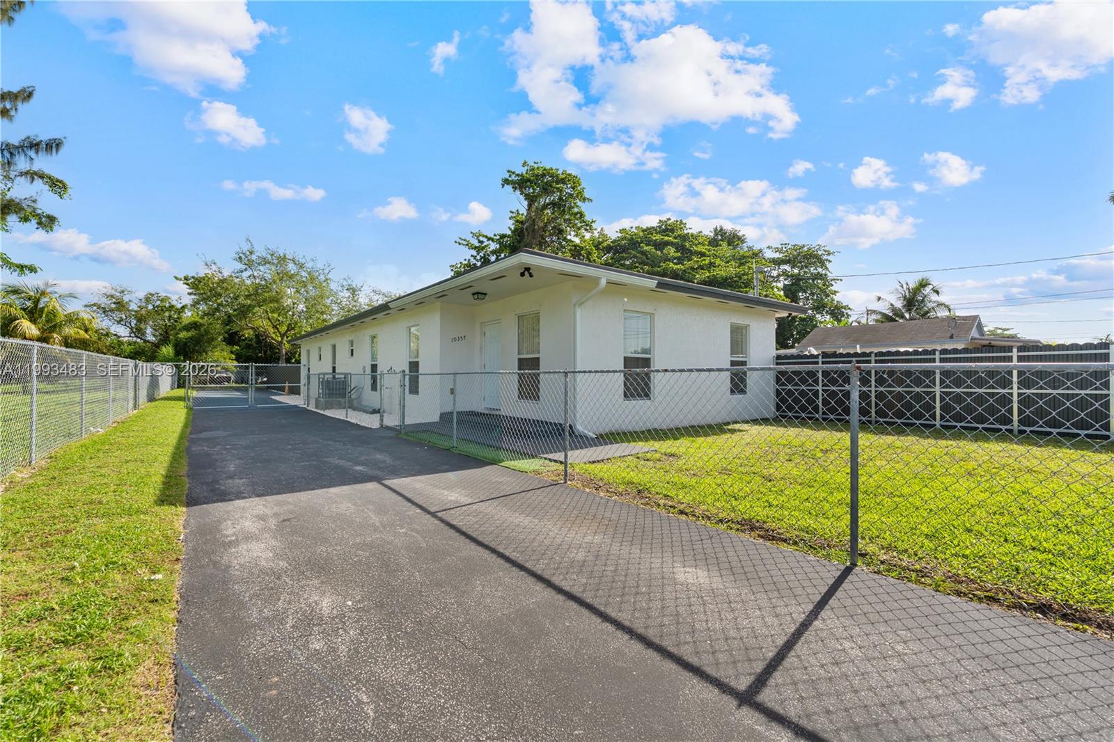 10357 Southwest 178th Street, Unit 10357 Miami, FL 33157 - Photo 25 of 25 a view of a house with a backyard